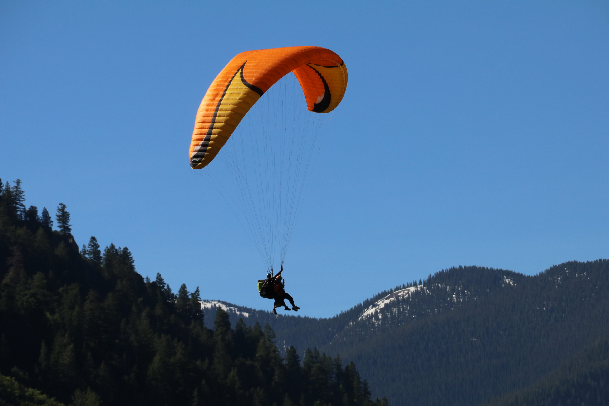 Tandem Paragliding over the Rocky Mountains for adventurous things to do in summer in Aspen