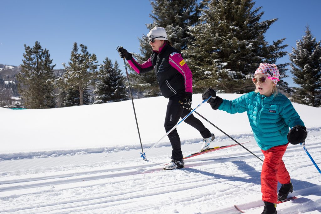Woman and Child Cross-Country Skiing on the Aspen Golf Course Trail